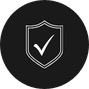 A black circular icon with a white shield outline and a check mark inside it symbolizes trust and reliability, much like the expert tree care services offered in Berks County, PA.